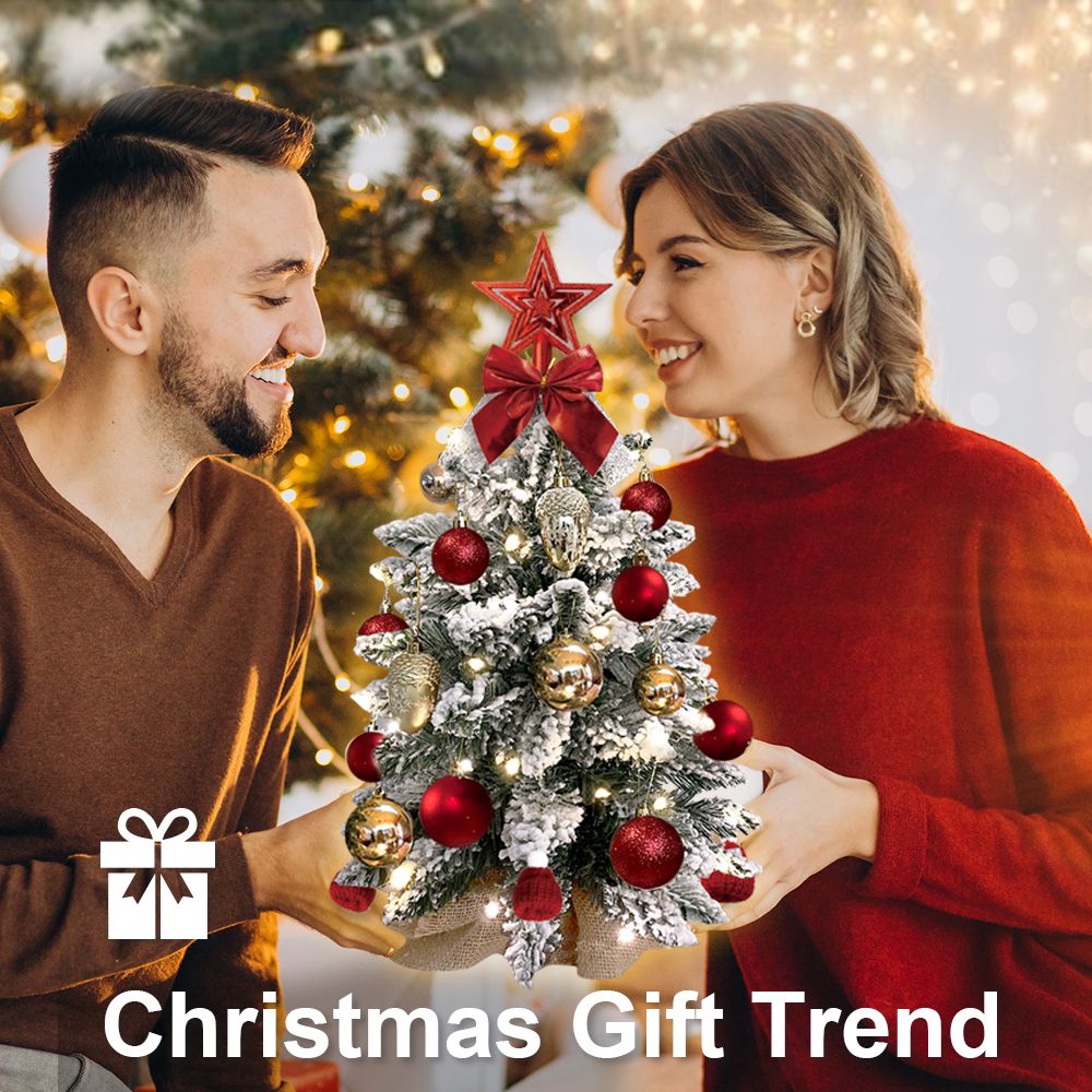 22 inch artificial Christmas tree silver decorated with red and gold ornaments and a red star topper