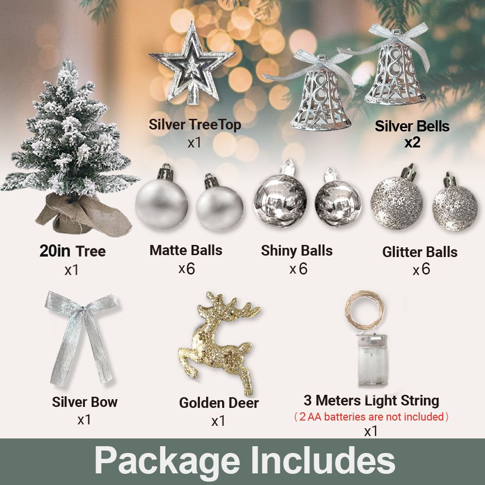 22 inch artificial Christmas tree silver with decorative silver bells, star topper, matte shiny and glitter balls, bow, golden deer, and light string