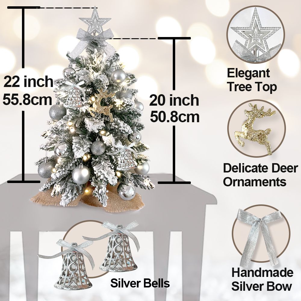 22 inch artificial Christmas tree silver with silver bells, delicate deer ornaments, elegant tree top, and handmade silver bow