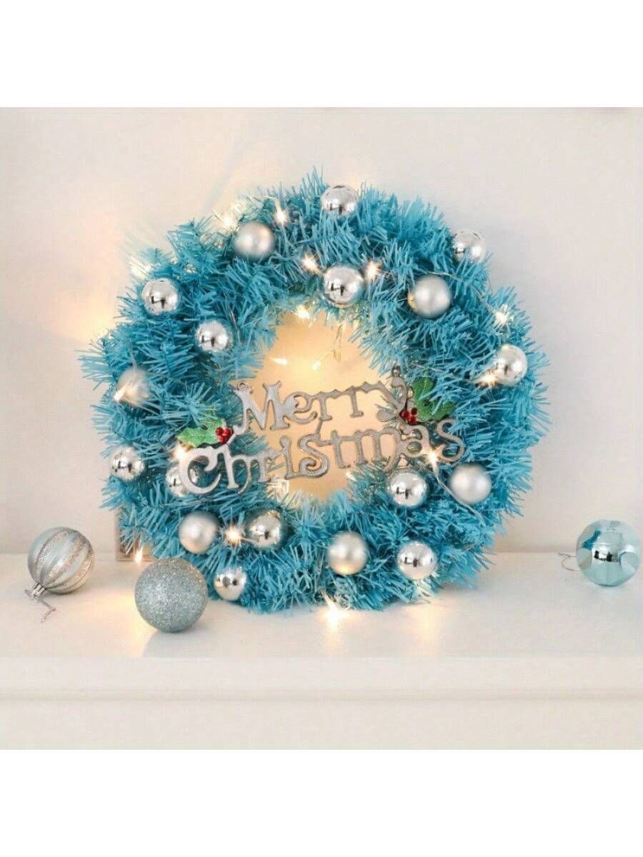 24 inch blue Christmas wreath decorated with silver ornaments and a Merry Christmas sign