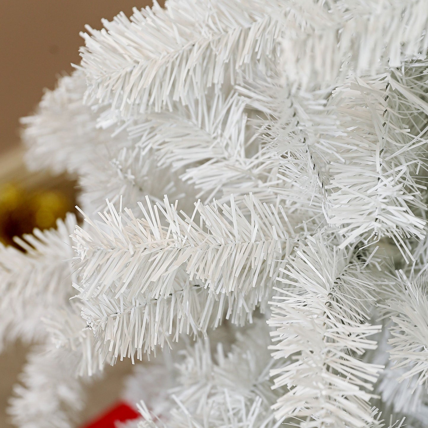 Close-up of a 6ft white artificial Christmas tree branches showing realistic texture and shape