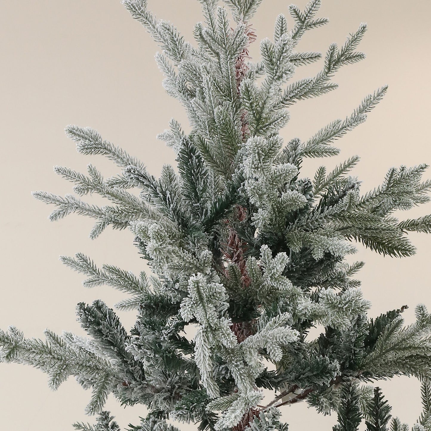 7.5ft snow flocked artificial Christmas tree with realistic snow-covered branches for festive decor