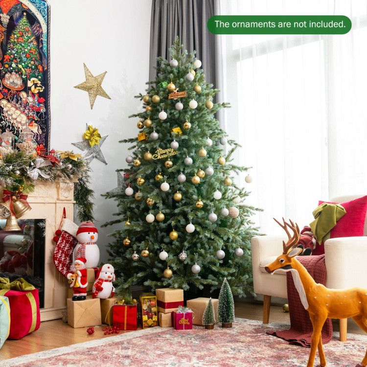 7 foot artificial Christmas tree decorated with gold and silver ornaments in cozy living room setting