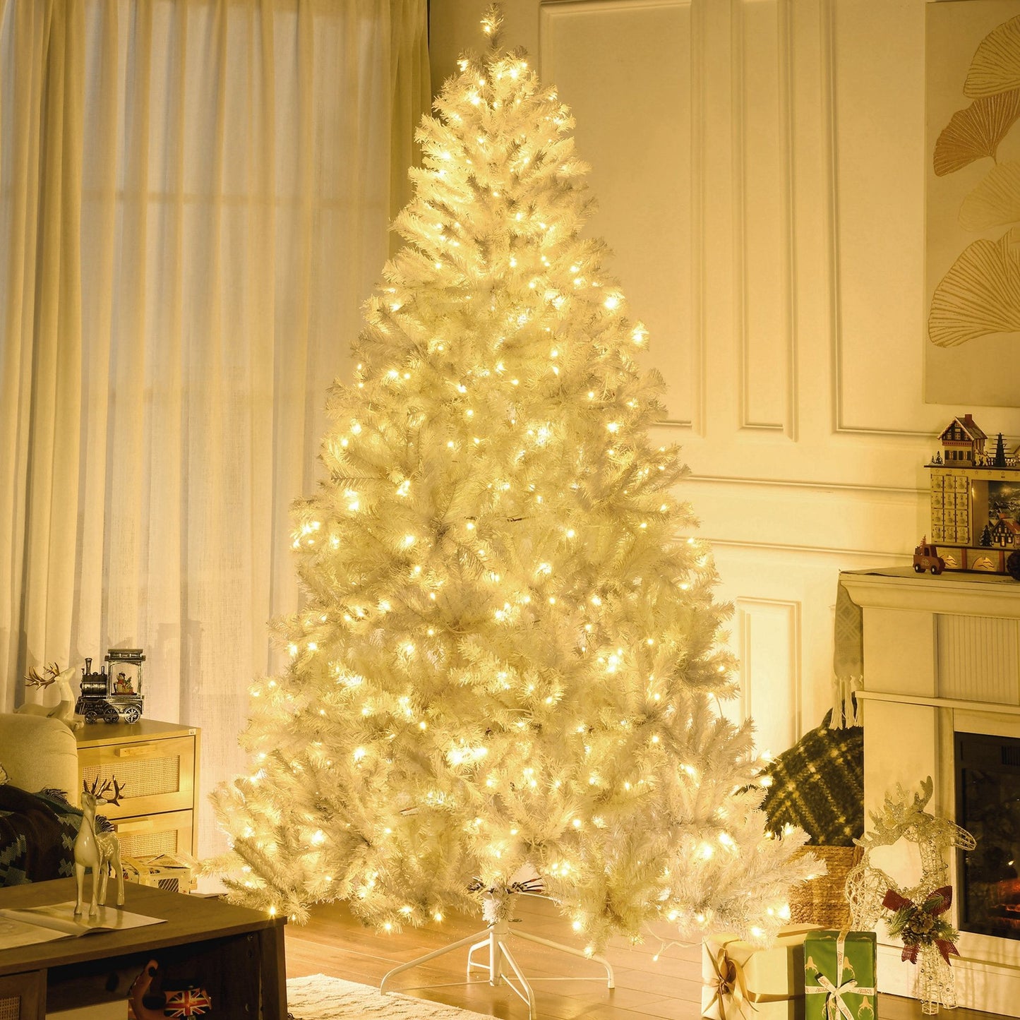 7.5 ft prelit white Christmas tree with warm white lights in a cozy living room setting