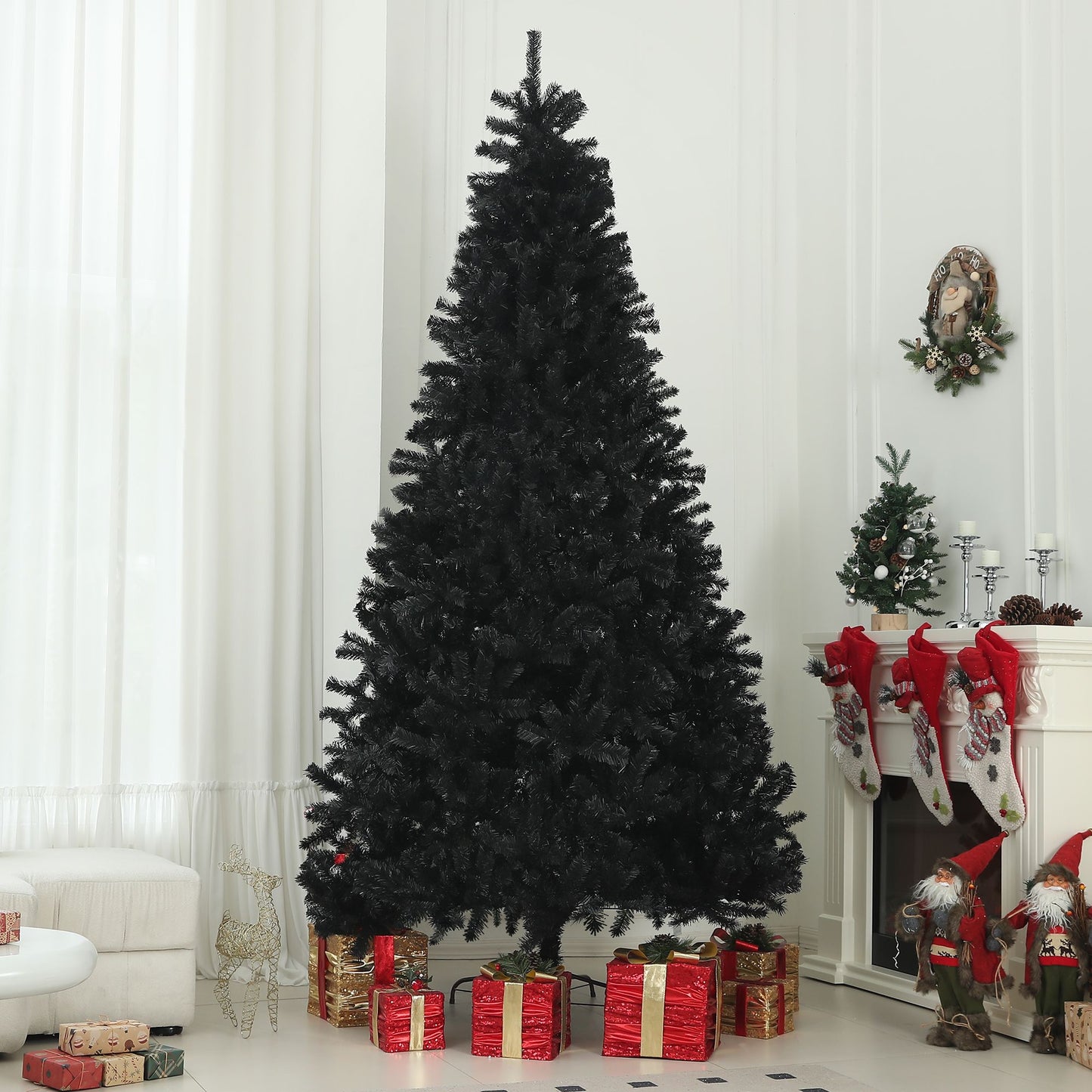 9ft black artificial Christmas tree standing tall in a bright living room with presents underneath