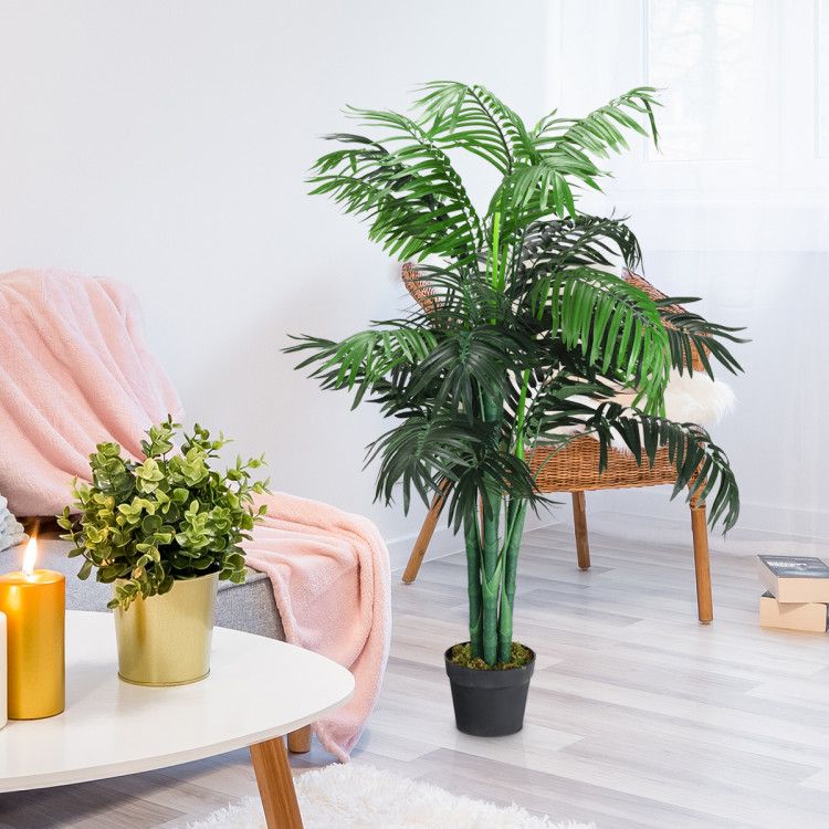 Lifelike artificial areca palm tree in a stylish living room setting with decorative plants
