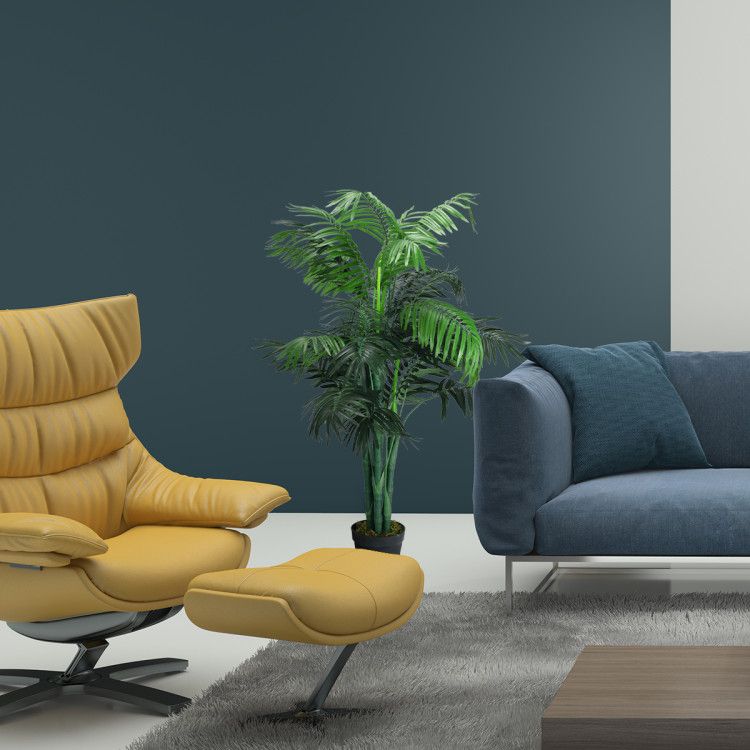 Modern living room with a yellow swivel chair and artificial areca palm tree for elegant decor