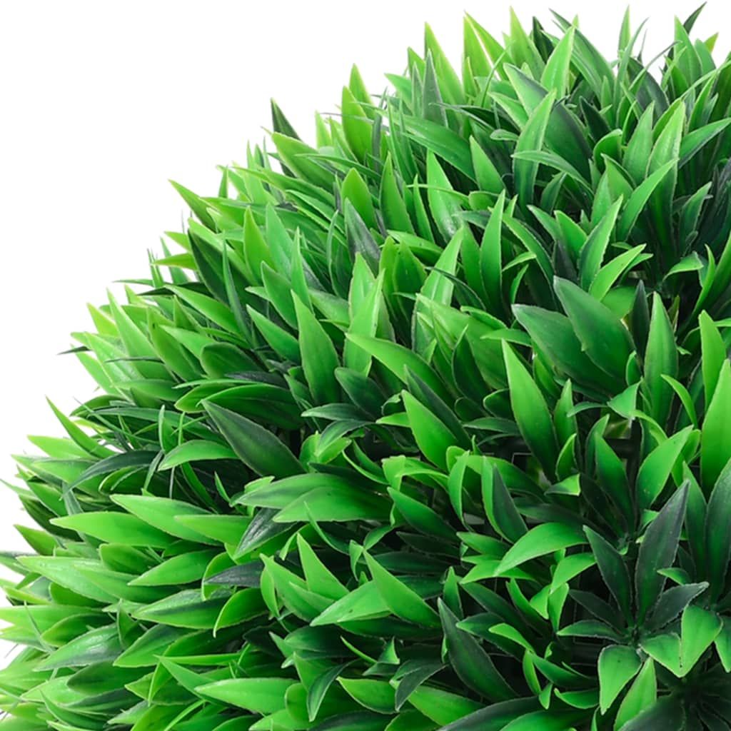 Close-up of green artificial boxwood ball decor with dense vibrant leaves for home decoration