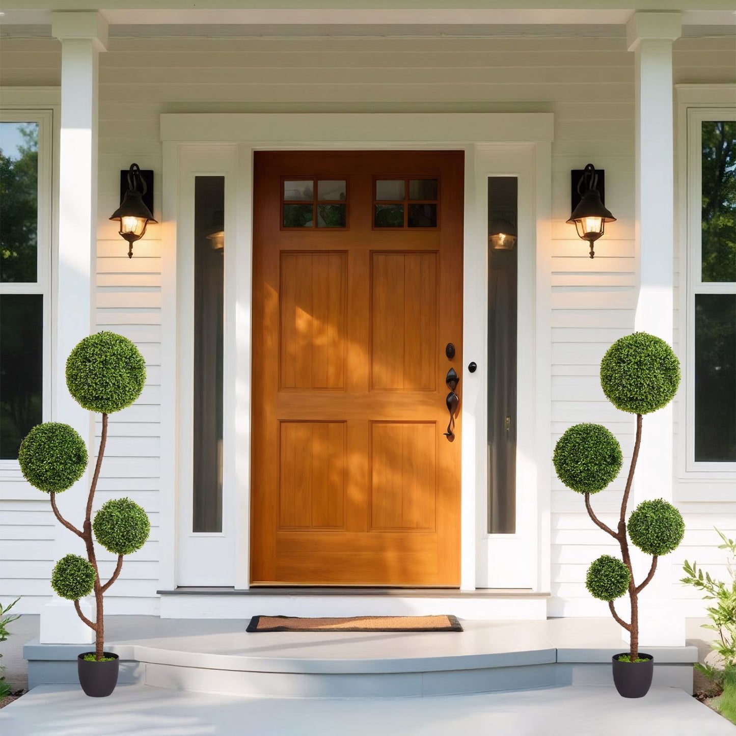 Elegant artificial boxwood topiary plants in decorative pots for outdoor entryways