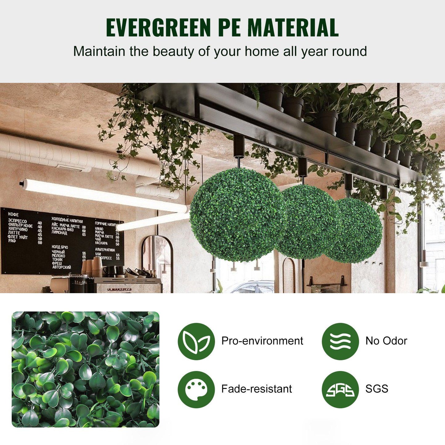 Three artificial boxwood topiary balls hanging in a modern cafe setting showcasing evergreen PE material