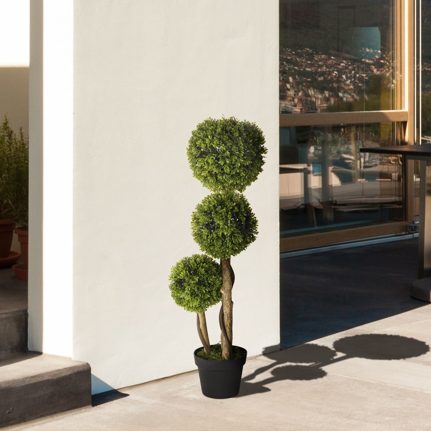 Stylish artificial boxwood topiary balls in a decorative pot for indoor and outdoor decor