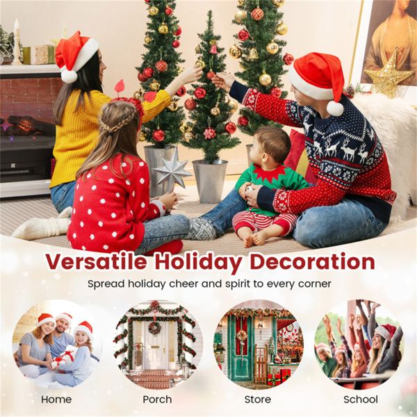 Family decorating with artificial Christmas trees set for a festive holiday atmosphere