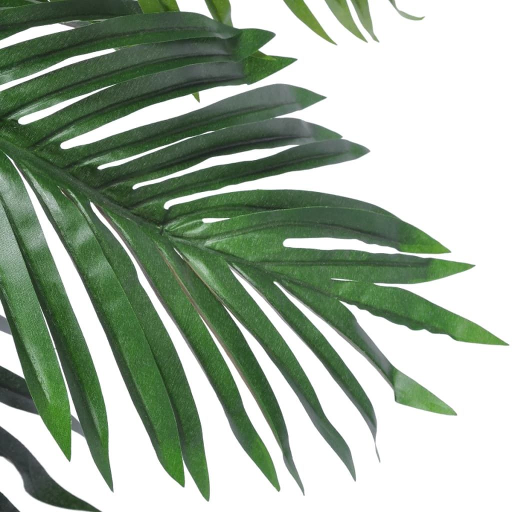 Lush green leaves of an artificial coconut palm tree for tropical decor and indoor landscaping