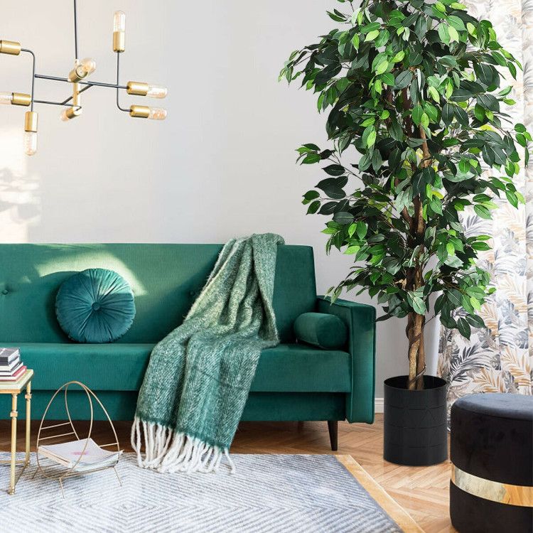 Stylish living room featuring a 6 foot artificial ficus tree beside a green couch and decorative accessories