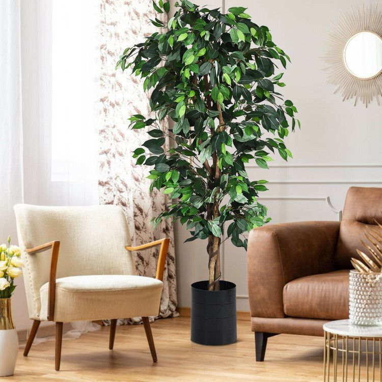 6 foot artificial ficus tree in a living room next to a cozy chair and modern couch