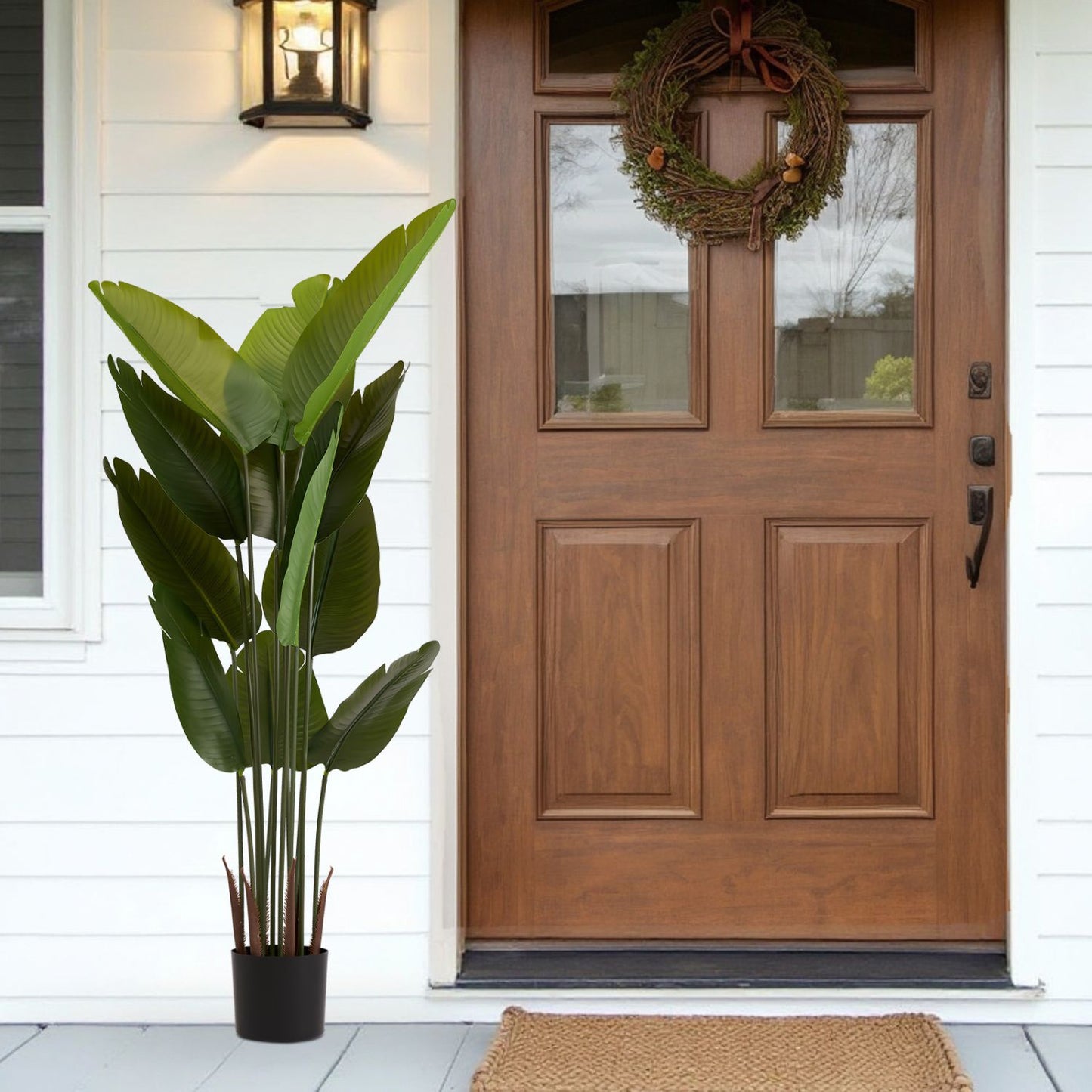 Elegant artificial green plant set in a modern pot, perfect for home entryway decor