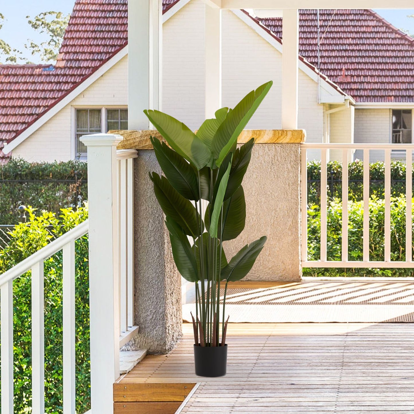 Artificial green plant set in a stylish pot, perfect for enhancing home decor with a touch of nature