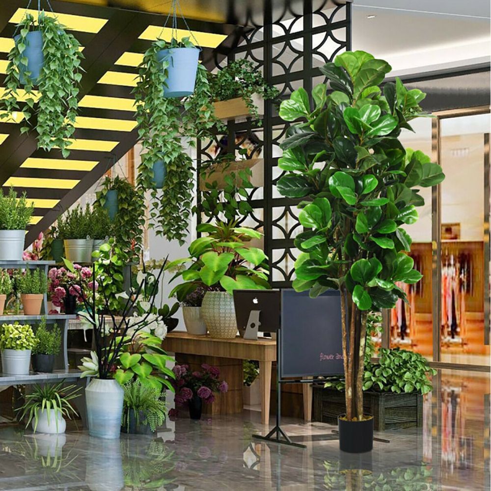 Decorative display of artificial green plants indoor in a modern setting with various plant arrangements