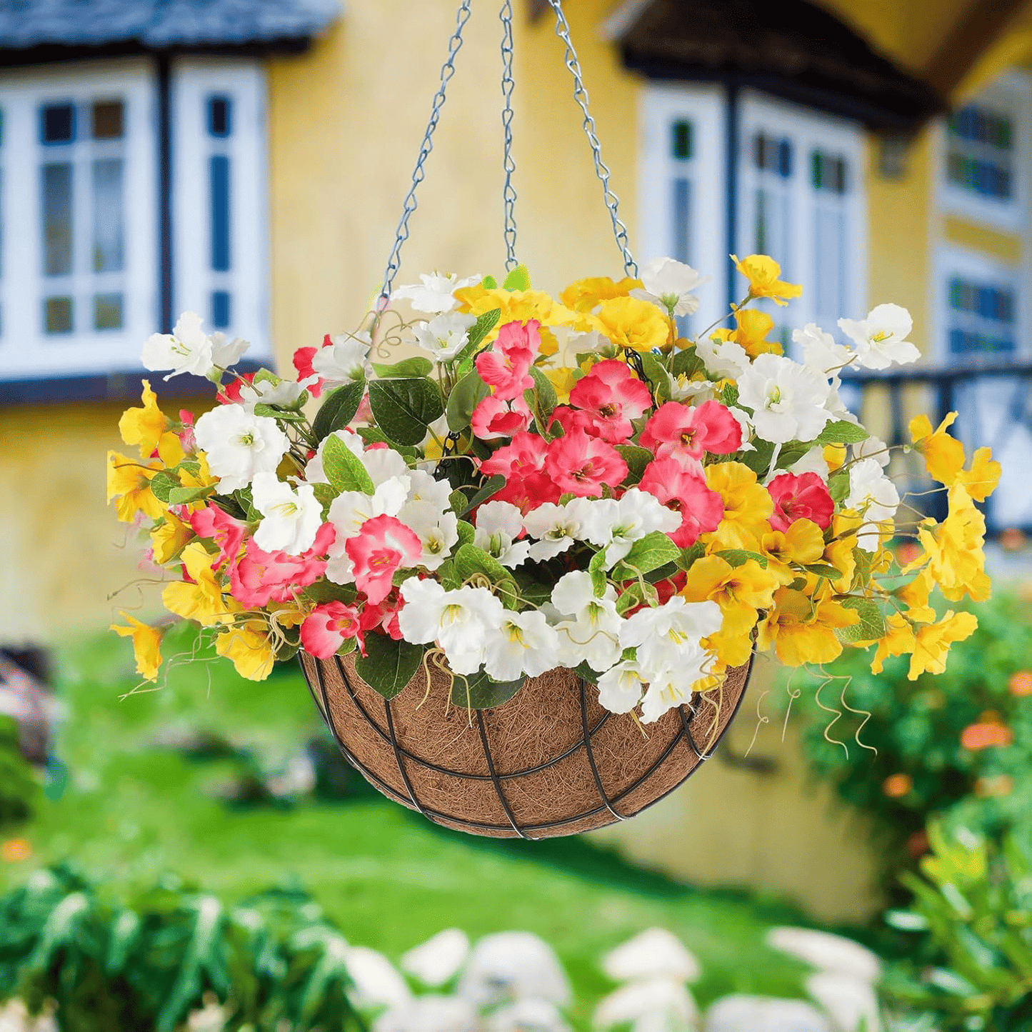 Colorful artificial hibiscus flowers outdoor in a hanging basket for brightening gardens