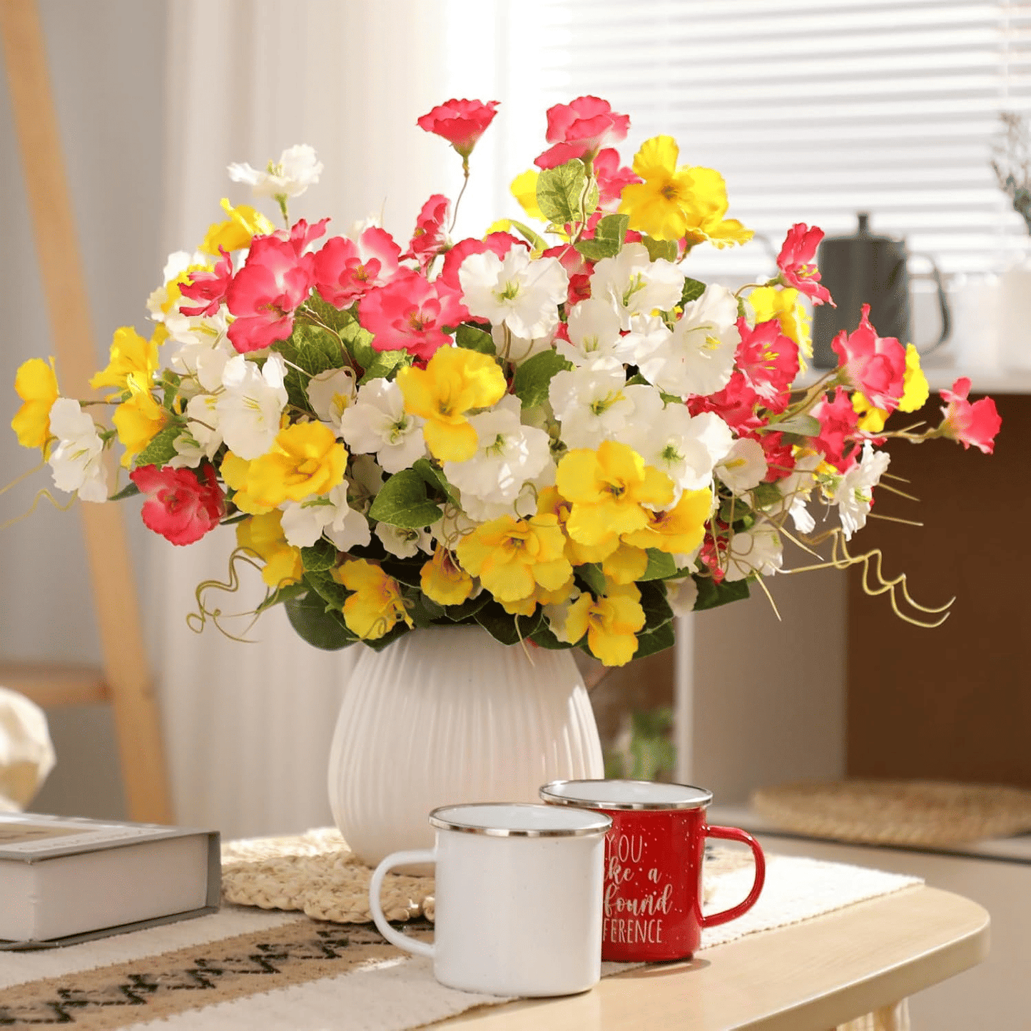 Vibrant arrangement of artificial hibiscus flowers outdoor in a decorative vase for home decor
