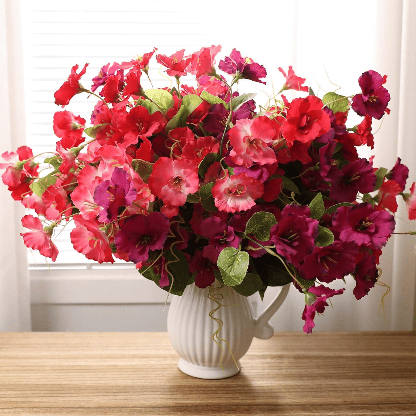 Vibrant artificial hibiscus flowers outdoor arrangement in a decorative vase for home decor