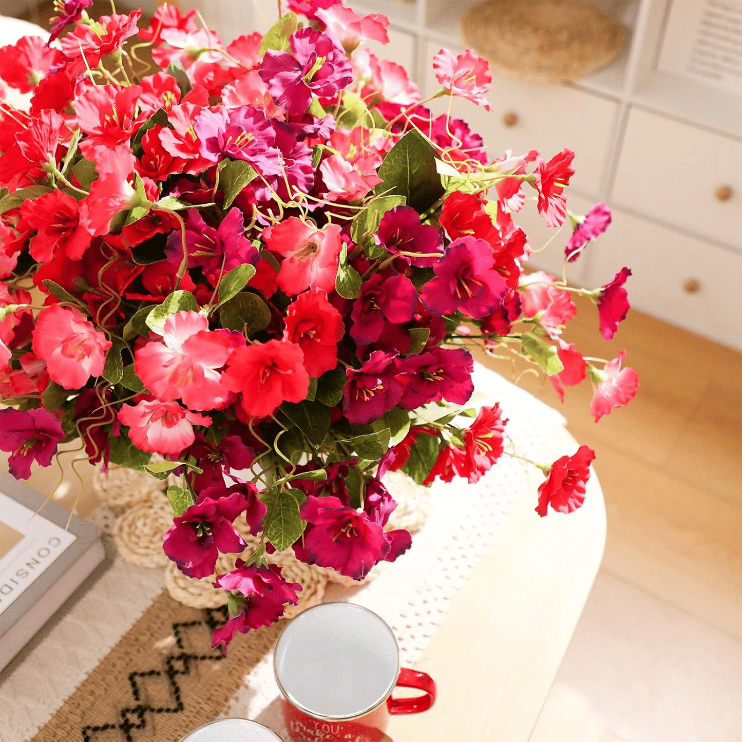 Vibrant artificial hibiscus flowers outdoor in a decorative vase for brightening home decor