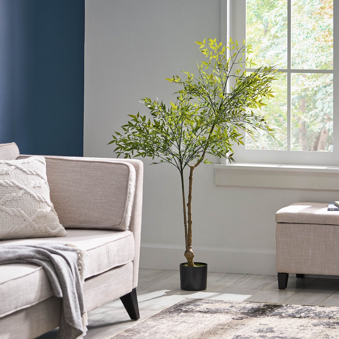 Lifelike artificial nandina plant decor in a modern living room setting with cozy furniture