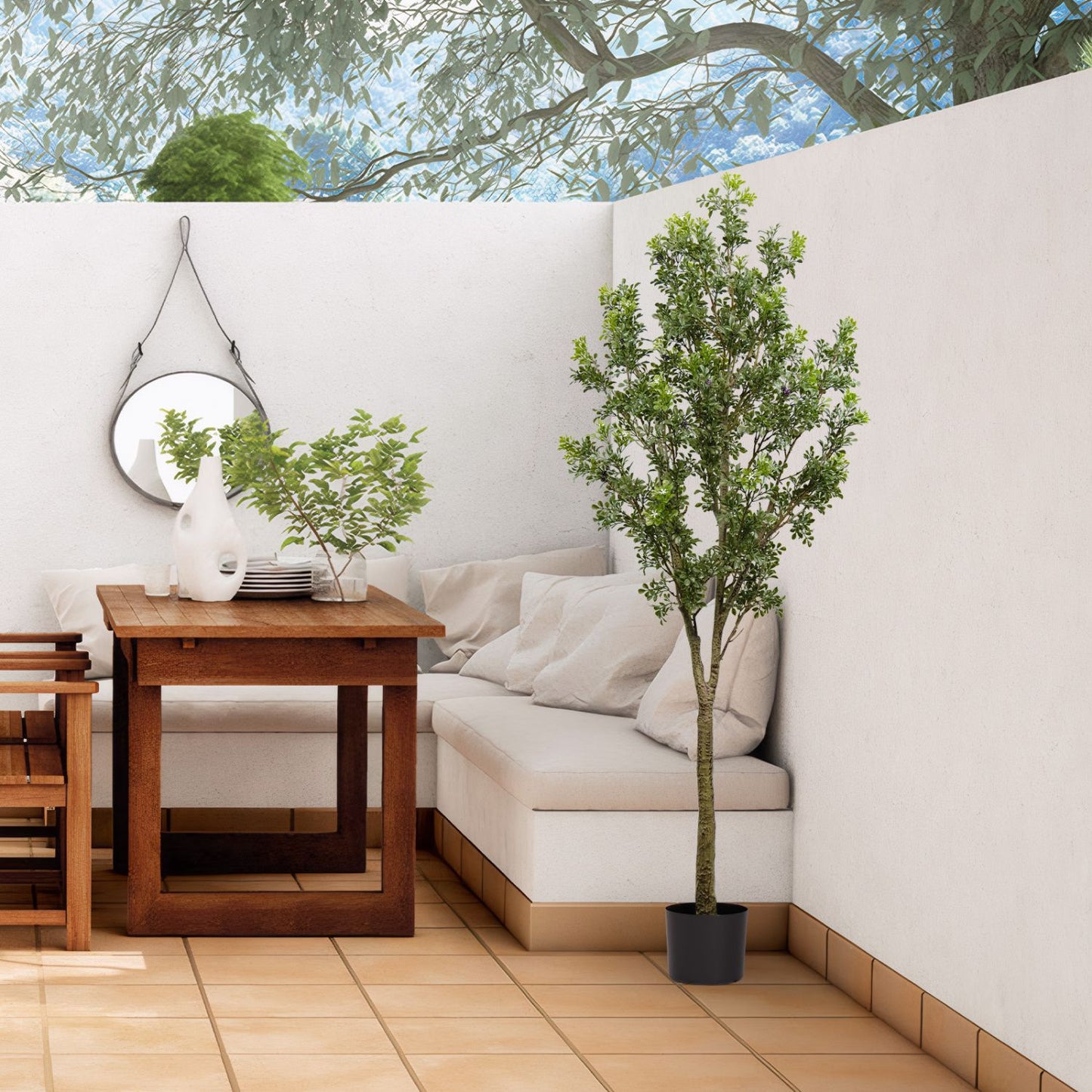 Artificial outdoor garden branches in a modern patio setting with a cozy seating area