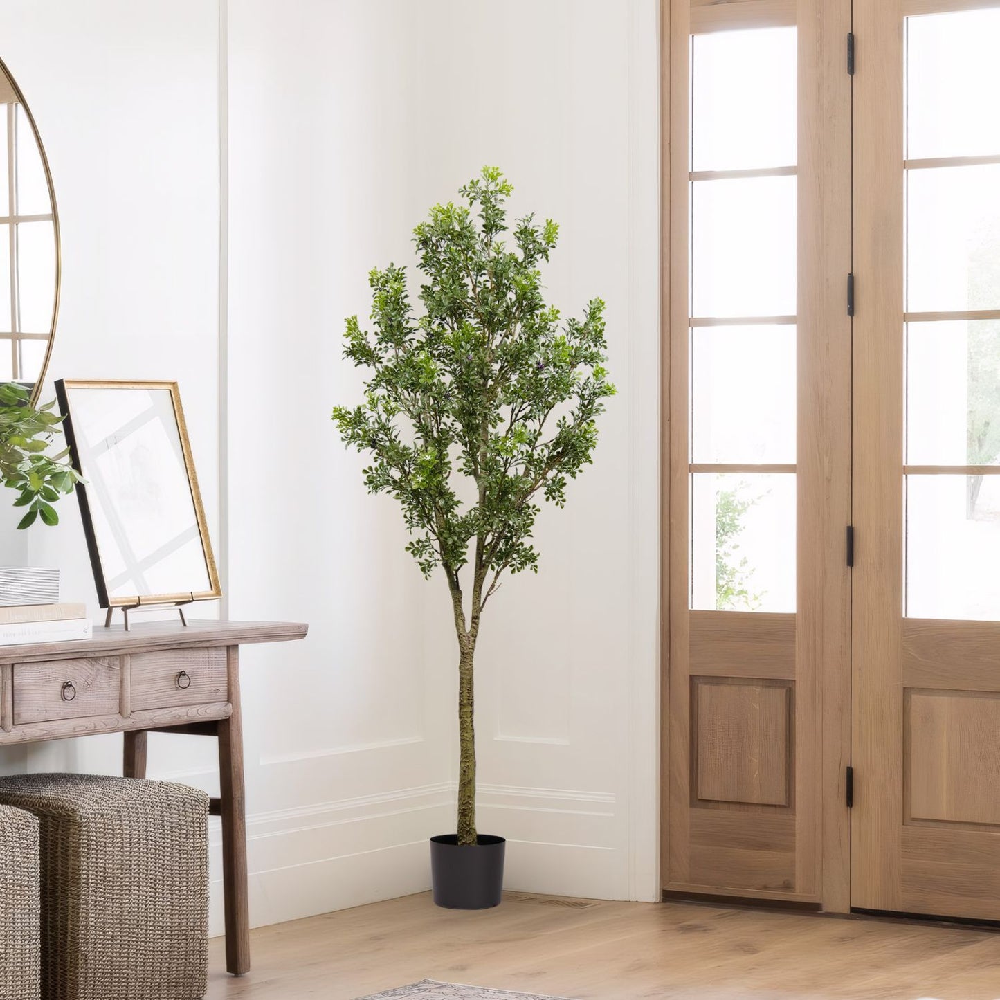 Stylish artificial outdoor garden branches in a decorative pot adding greenery to home decor