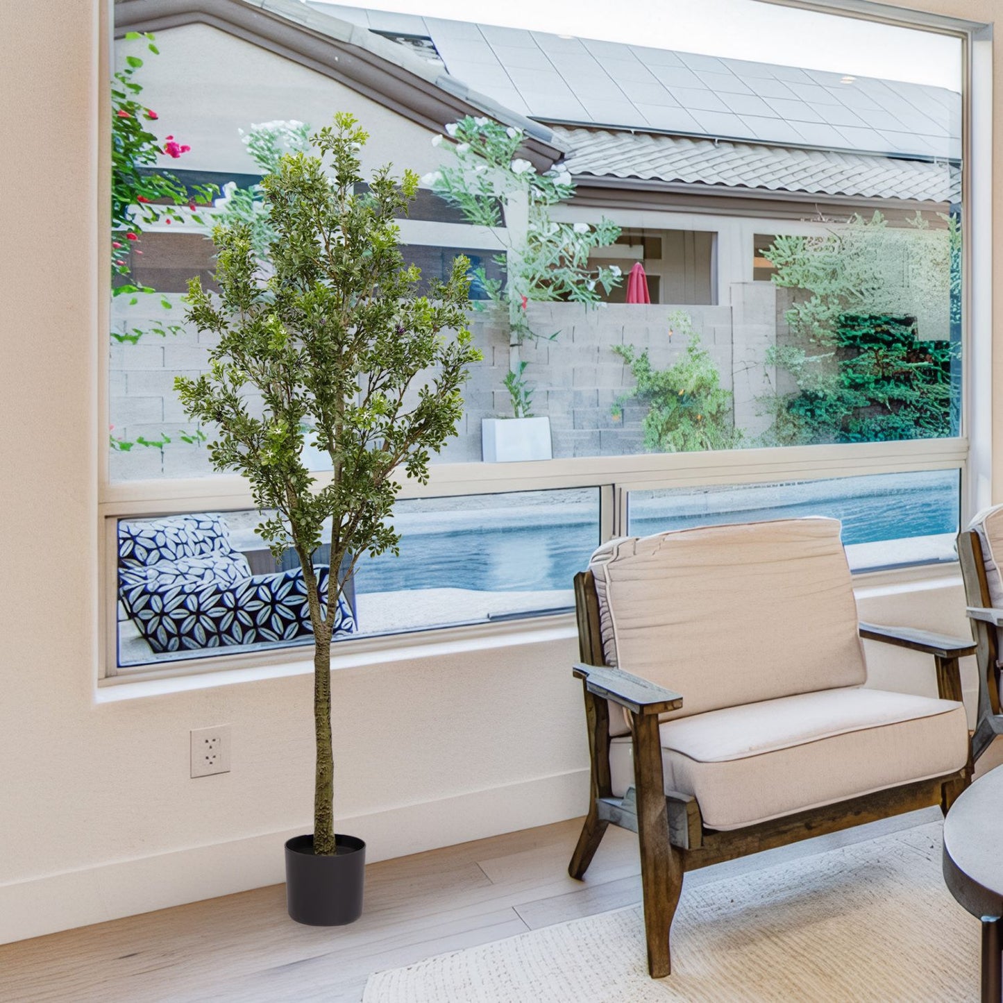 Artificial outdoor garden branches in a pot, enhancing the indoor space with greenery