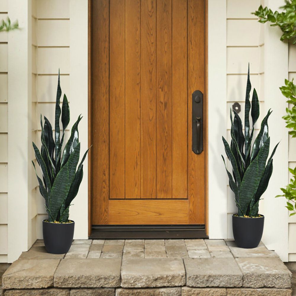 Set of artificial snake plant decor in stylish black pots for enhancing home entrance aesthetics