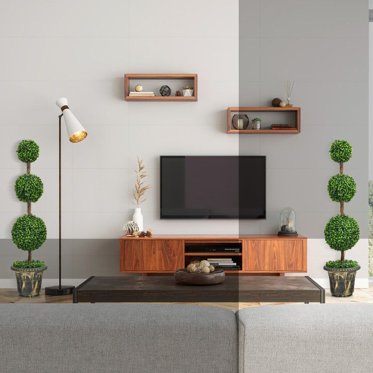 Elegant artificial topiary tree decor displayed in a contemporary living room setting