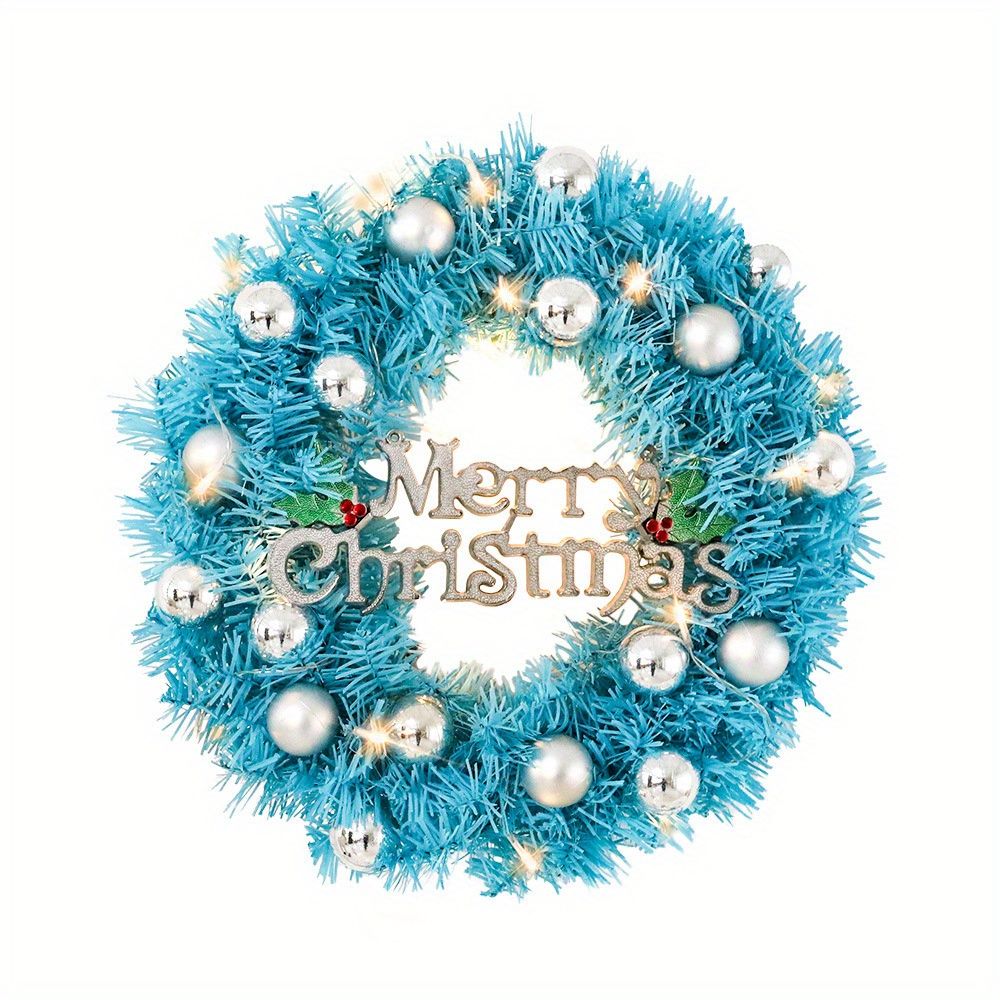 Blue Christmas wreath decor featuring silver ornaments and a Merry Christmas sign