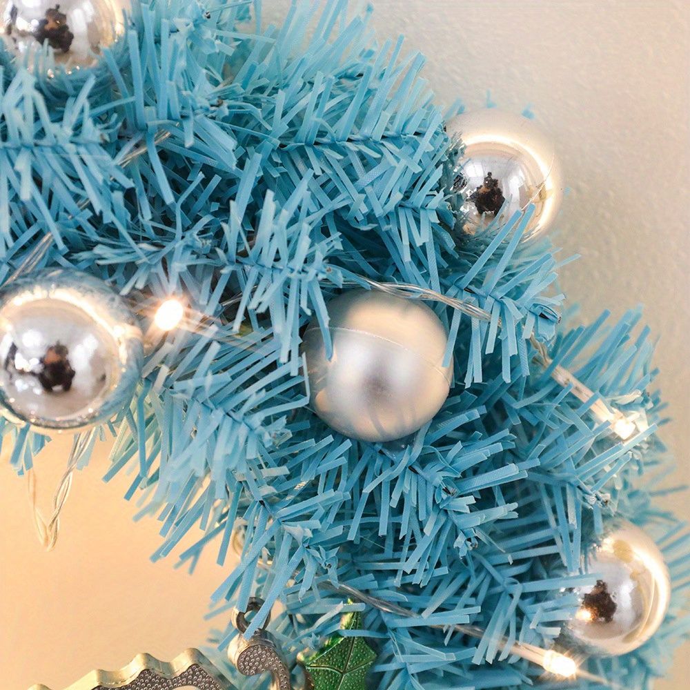 Blue Christmas wreath decor featuring shiny ornaments and festive decorations for holiday cheer
