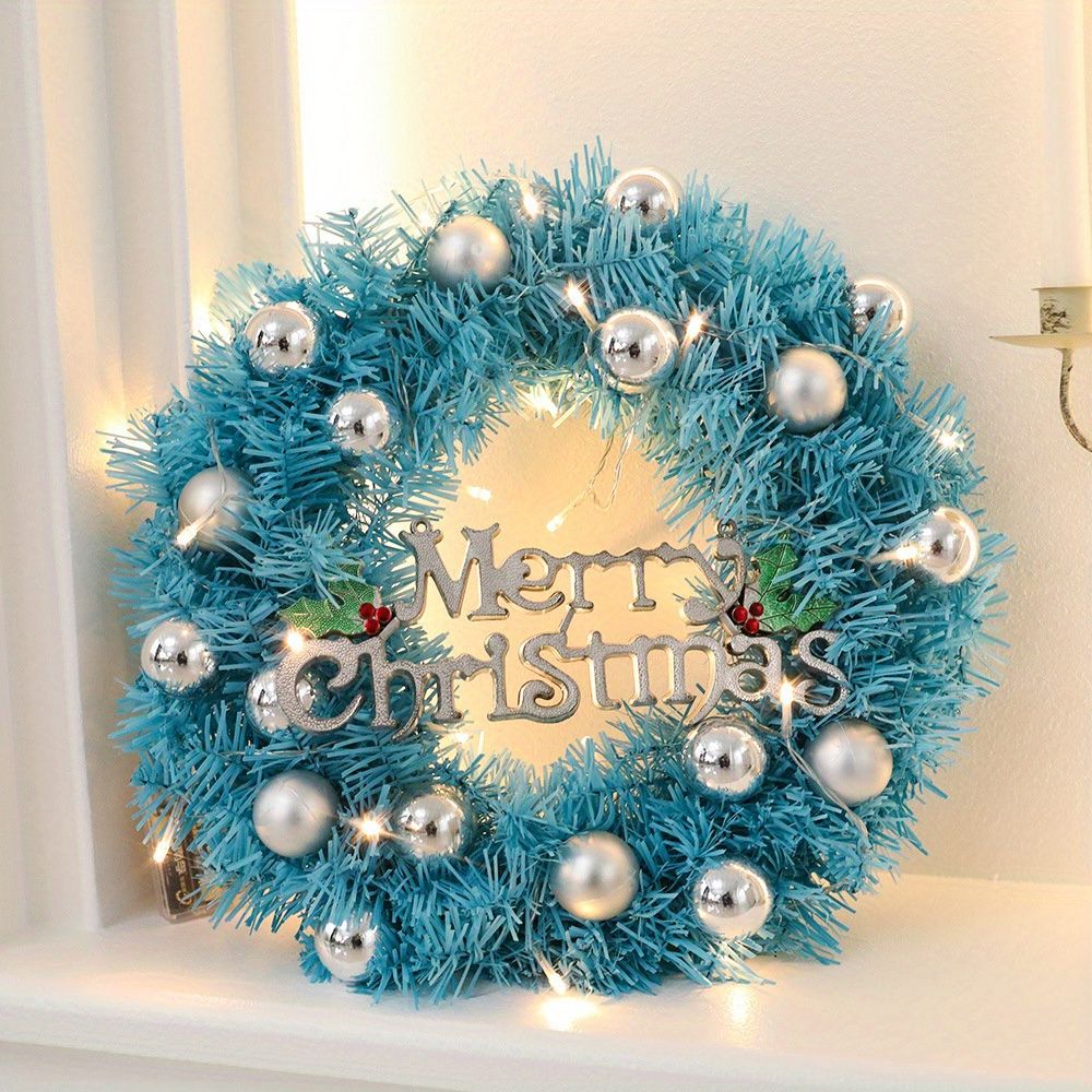 Festive blue Christmas wreath decor featuring silver ornaments and LED lights for holiday decoration