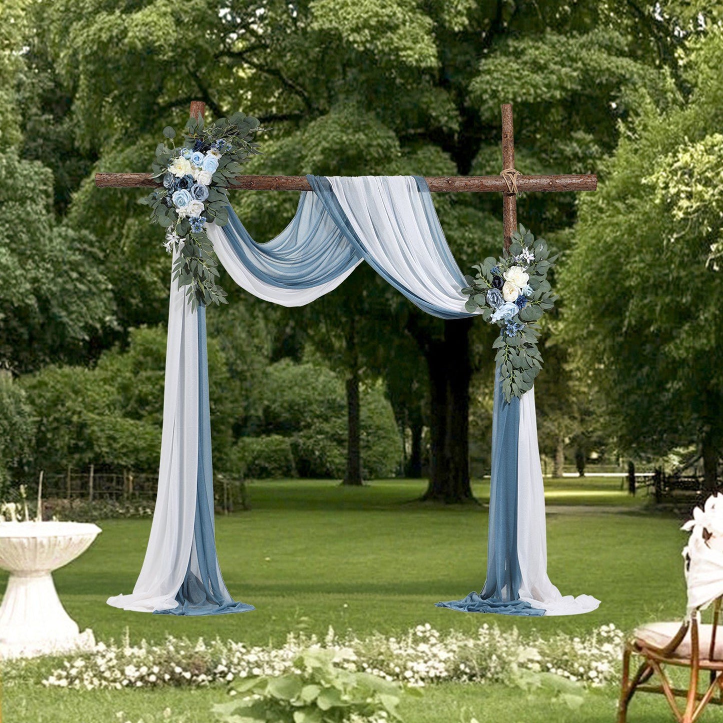 Outdoor wedding arch decorated with blue and white wedding arch flowers and draped fabric in blue and white