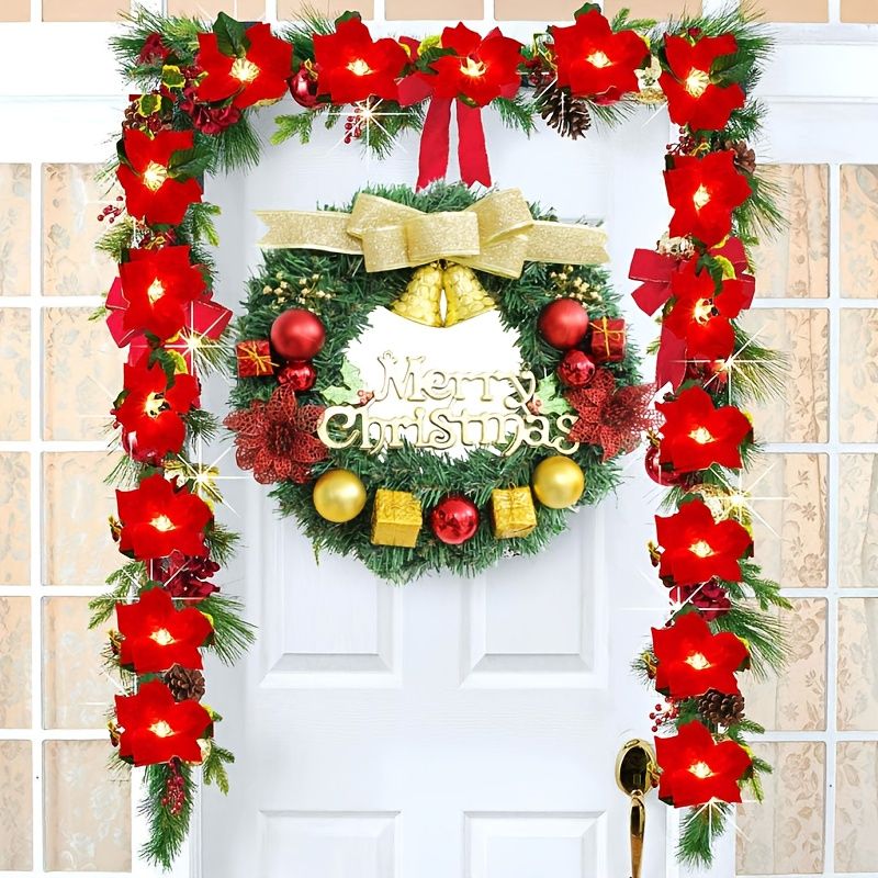 Colorful Christmas wreath for front door with red flowers, festive ornaments, and a golden bell