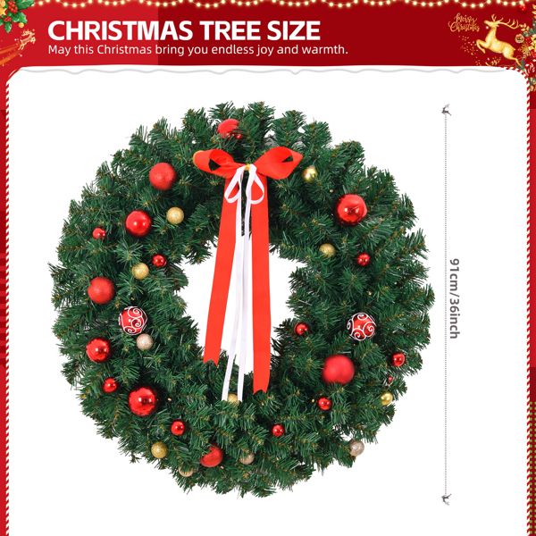 Large Christmas wreath with ornaments featuring red and gold baubles and a red bow ribbon