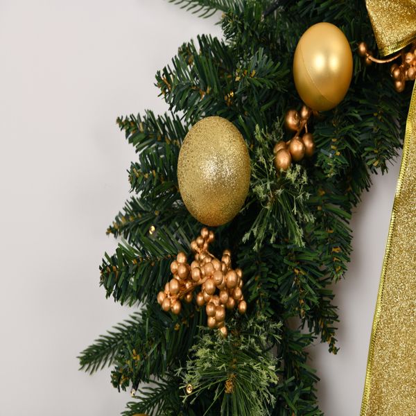Deluxe pre-lit Christmas wreath with remote, featuring gold ornaments and lush greenery