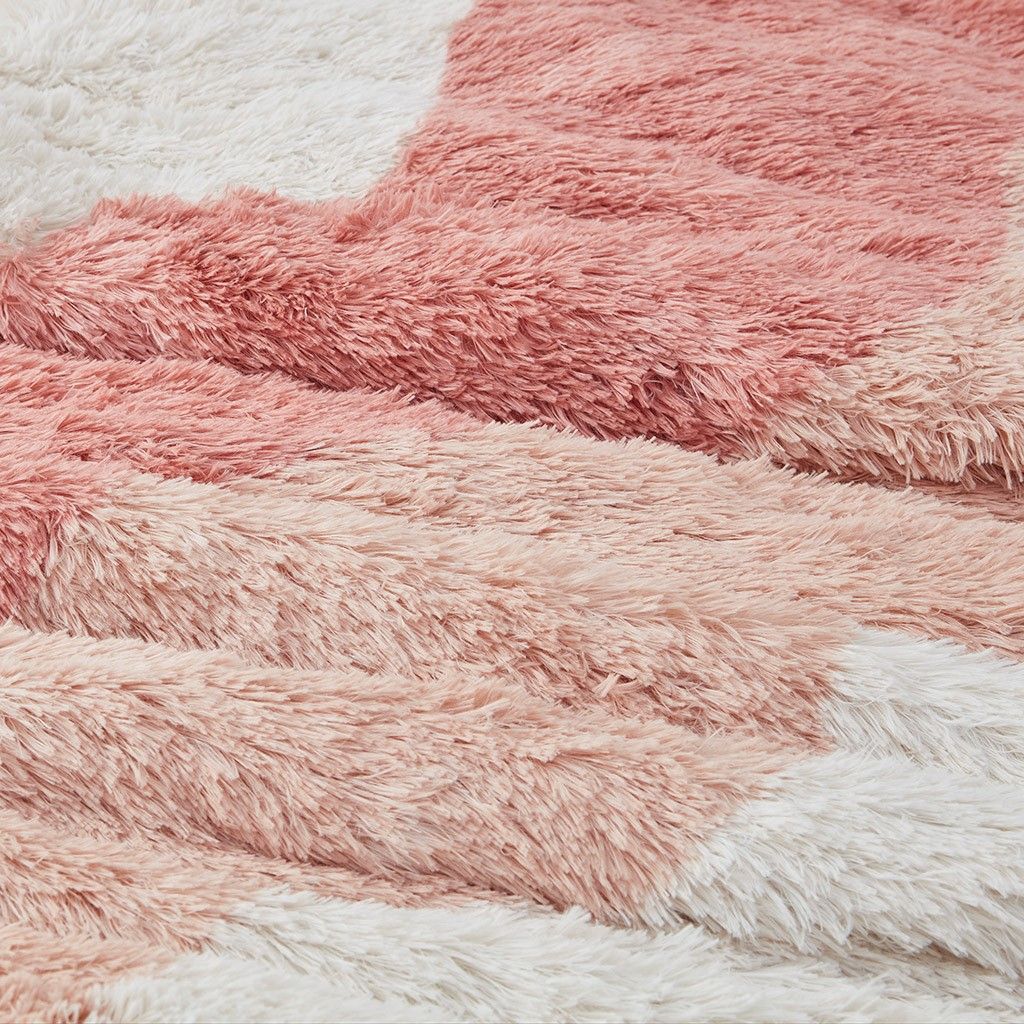 Close-up of pink and white ombre faux fur comforter set with soft plush texture from FauxMart.com