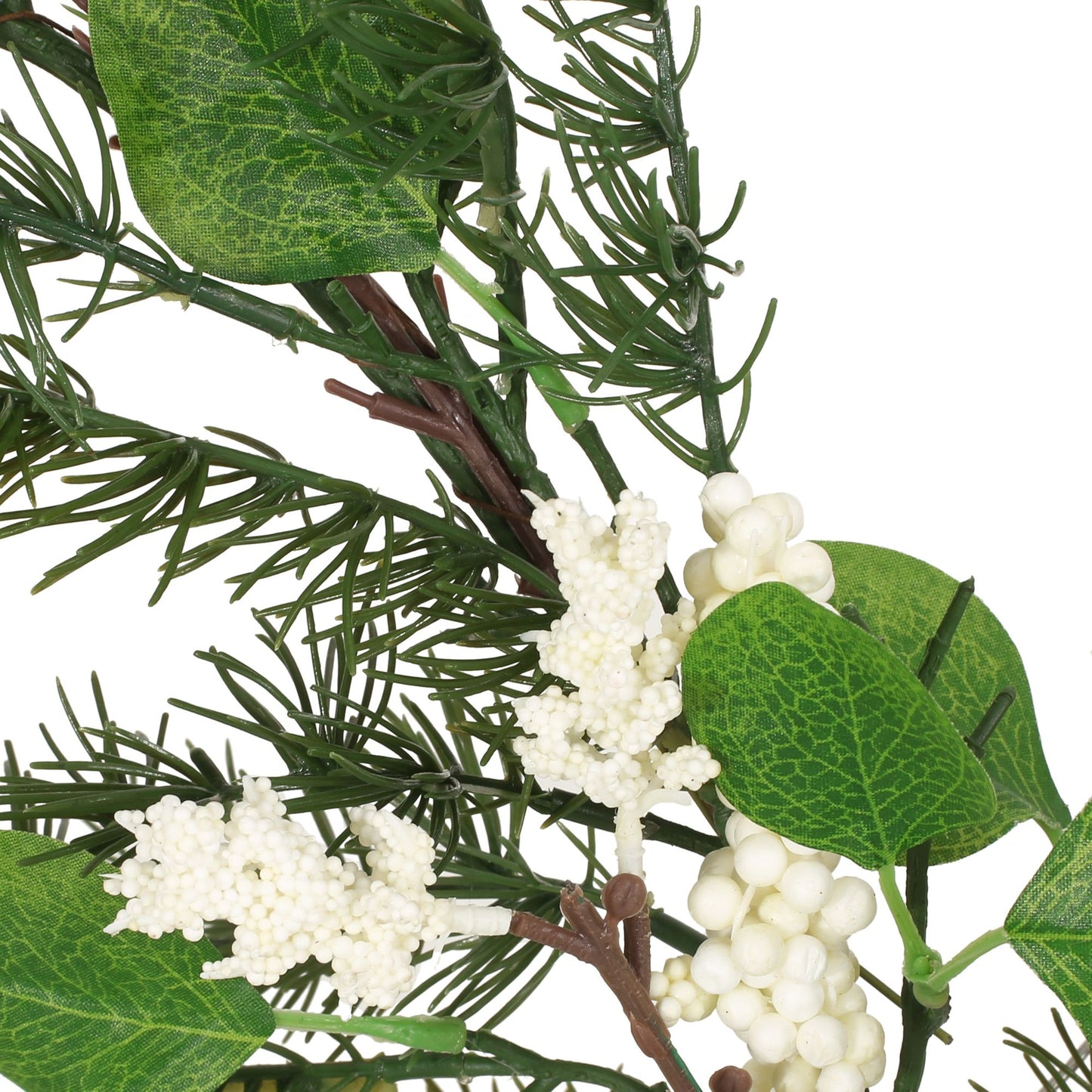 Close-up of eucalyptus Christmas garland with green leaves and white berry clusters decoration