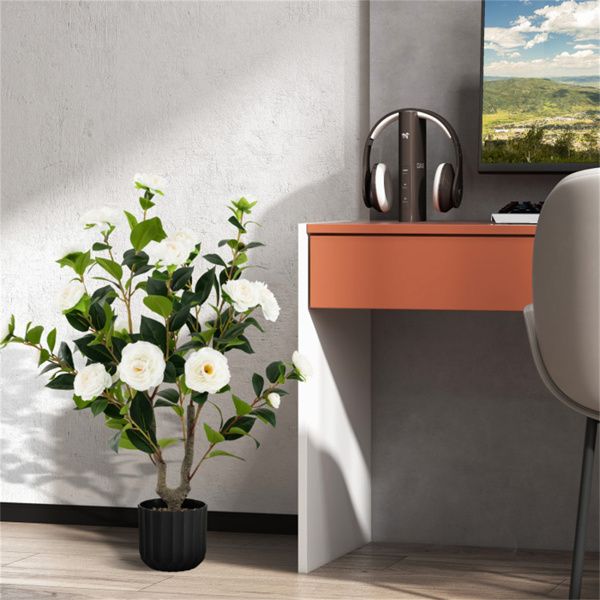 Lifelike faux camellia trees in a stylish pot, perfect for home or office decor.