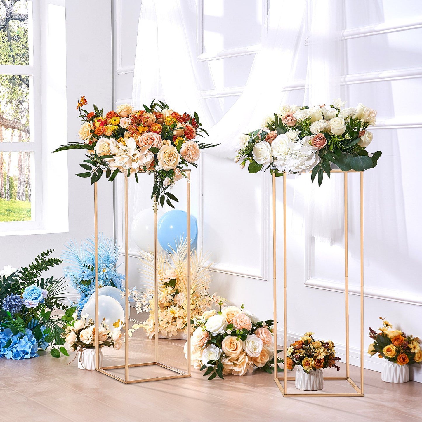 Elegant gold wedding flower stand featuring a variety of colorful roses and greenery for event decor