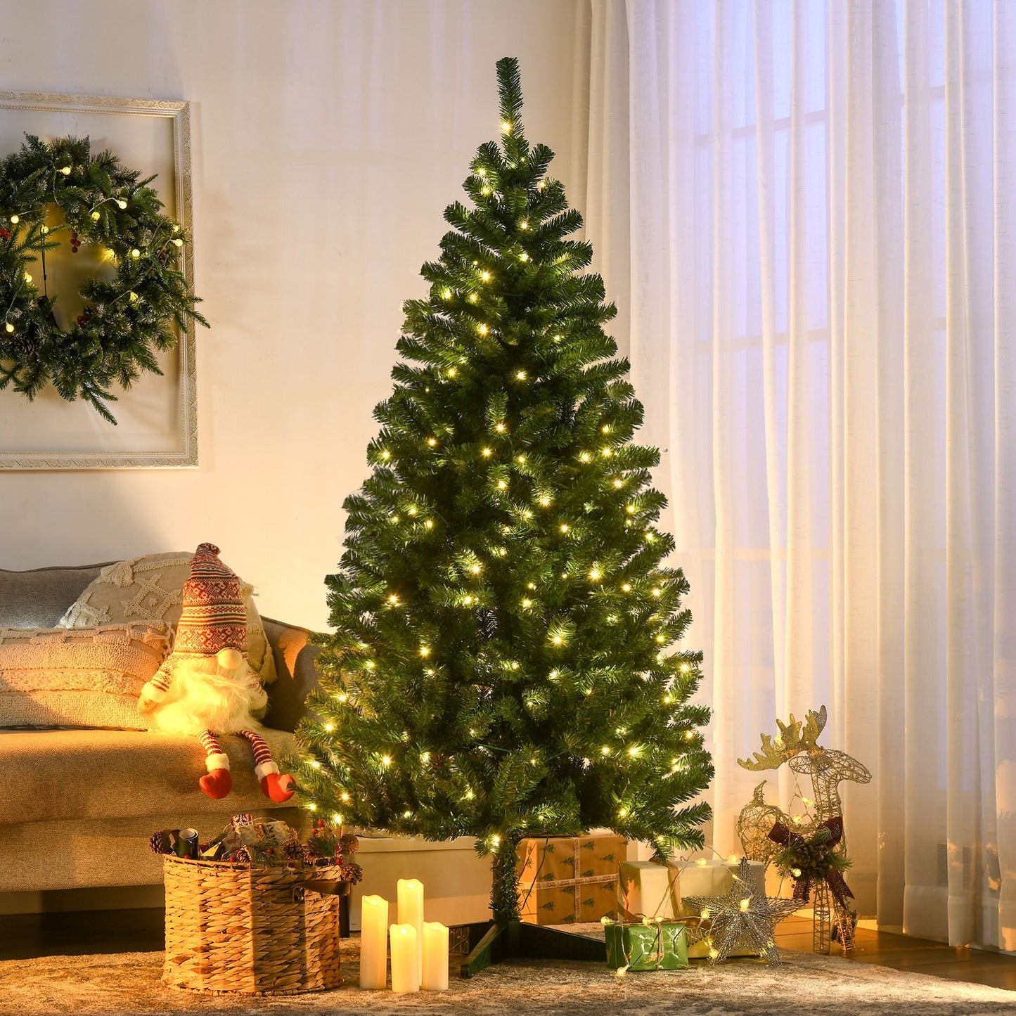 Holiday decor LED Christmas tree lit with warm white lights beside presents and a cozy living room setting