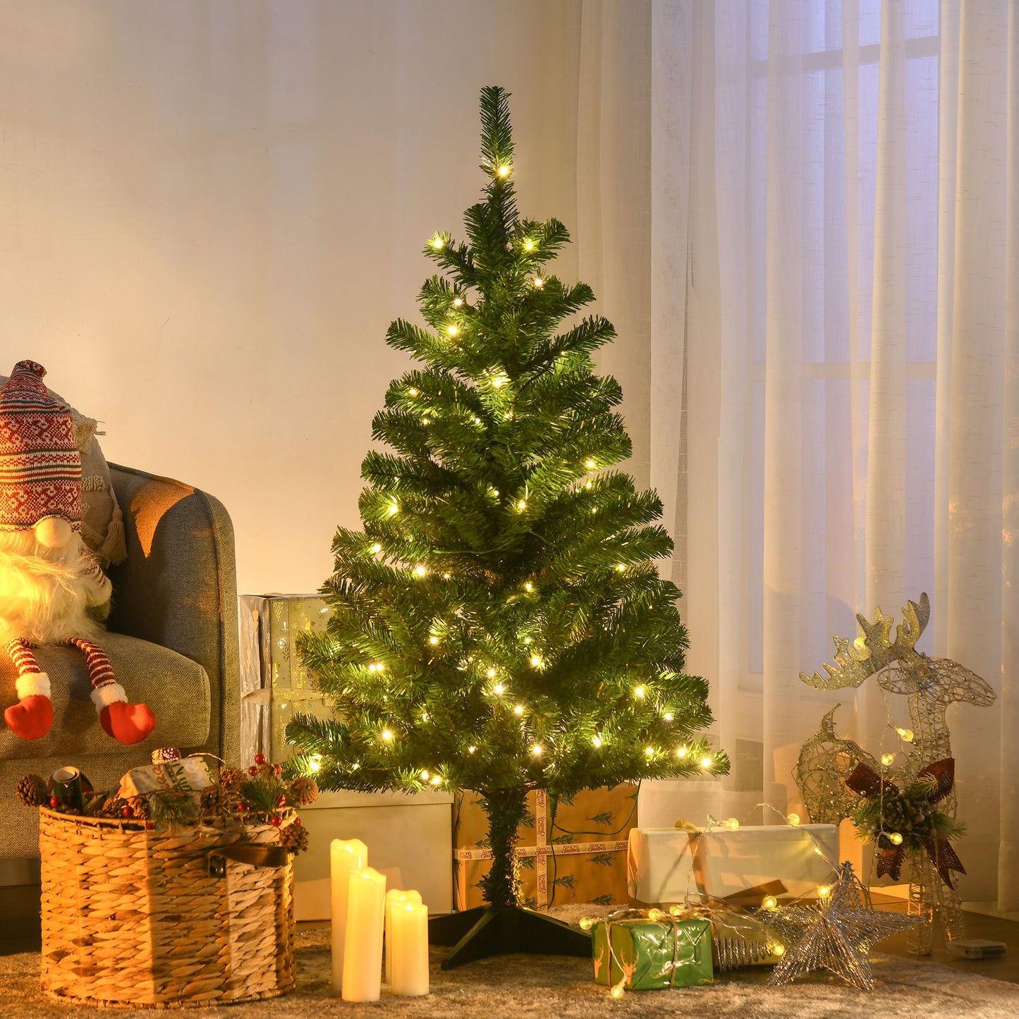Holiday decor LED Christmas tree with warm white lights surrounded by wrapped gifts and holiday decorations