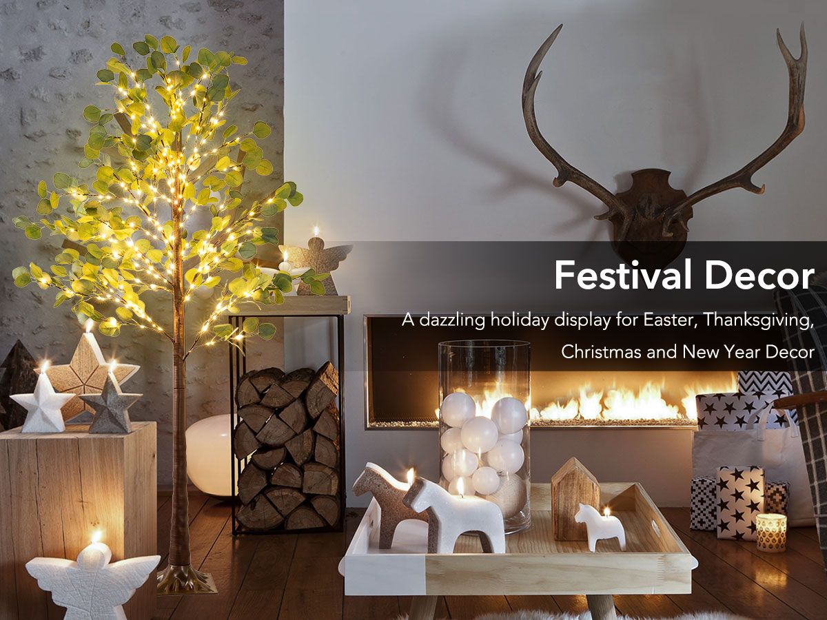 Lighted artificial olive tree with warm lights in cozy holiday living room decor setup