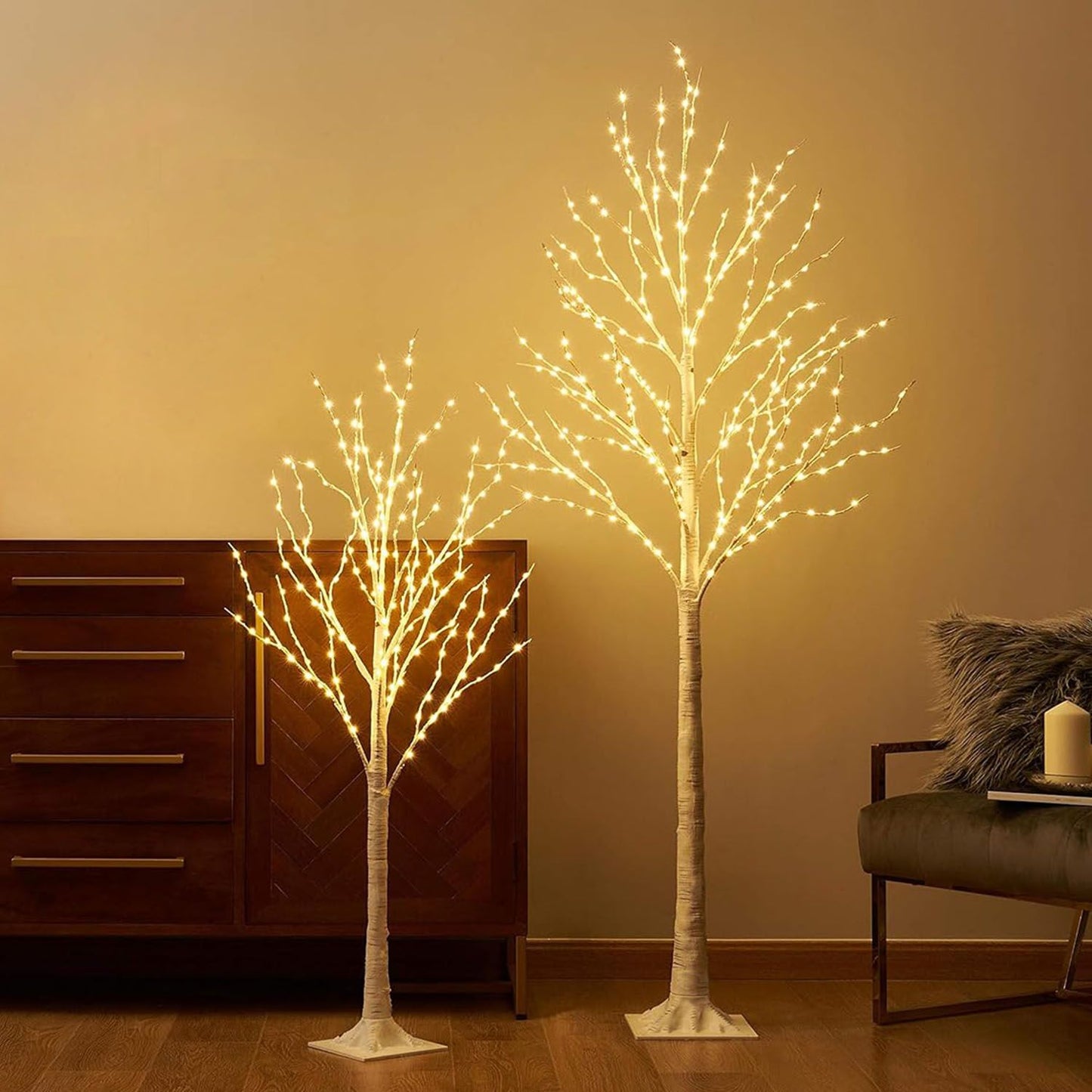 Two illuminated lighted birch tree decorations with warm white lights for holiday or home decor