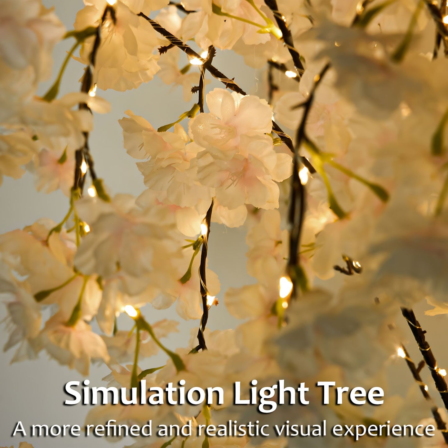 Lighted cherry blossom tree decor with soft white flowers and warm glowing lights for elegant ambiance