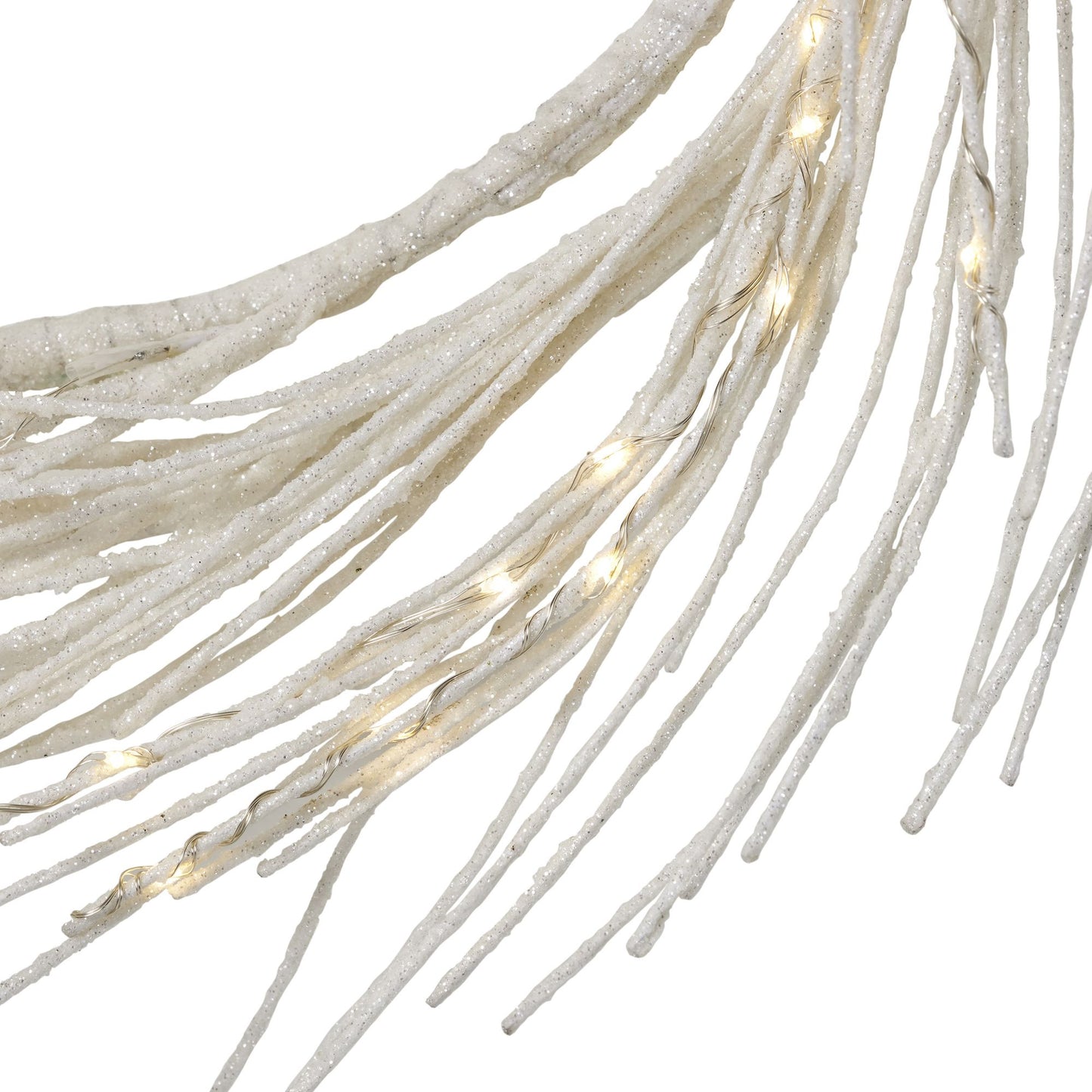 Close-up of lighted paper wreath strands with glowing warm white lights and textured design