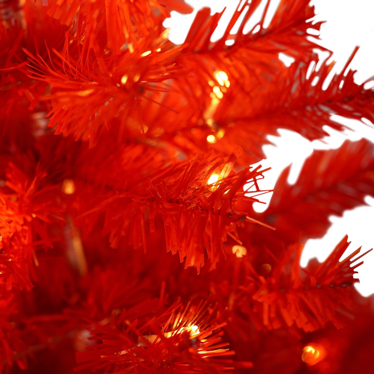 Close-up of FauxMart.com vibrant red lighted santa hat christmas tree with glowing lights